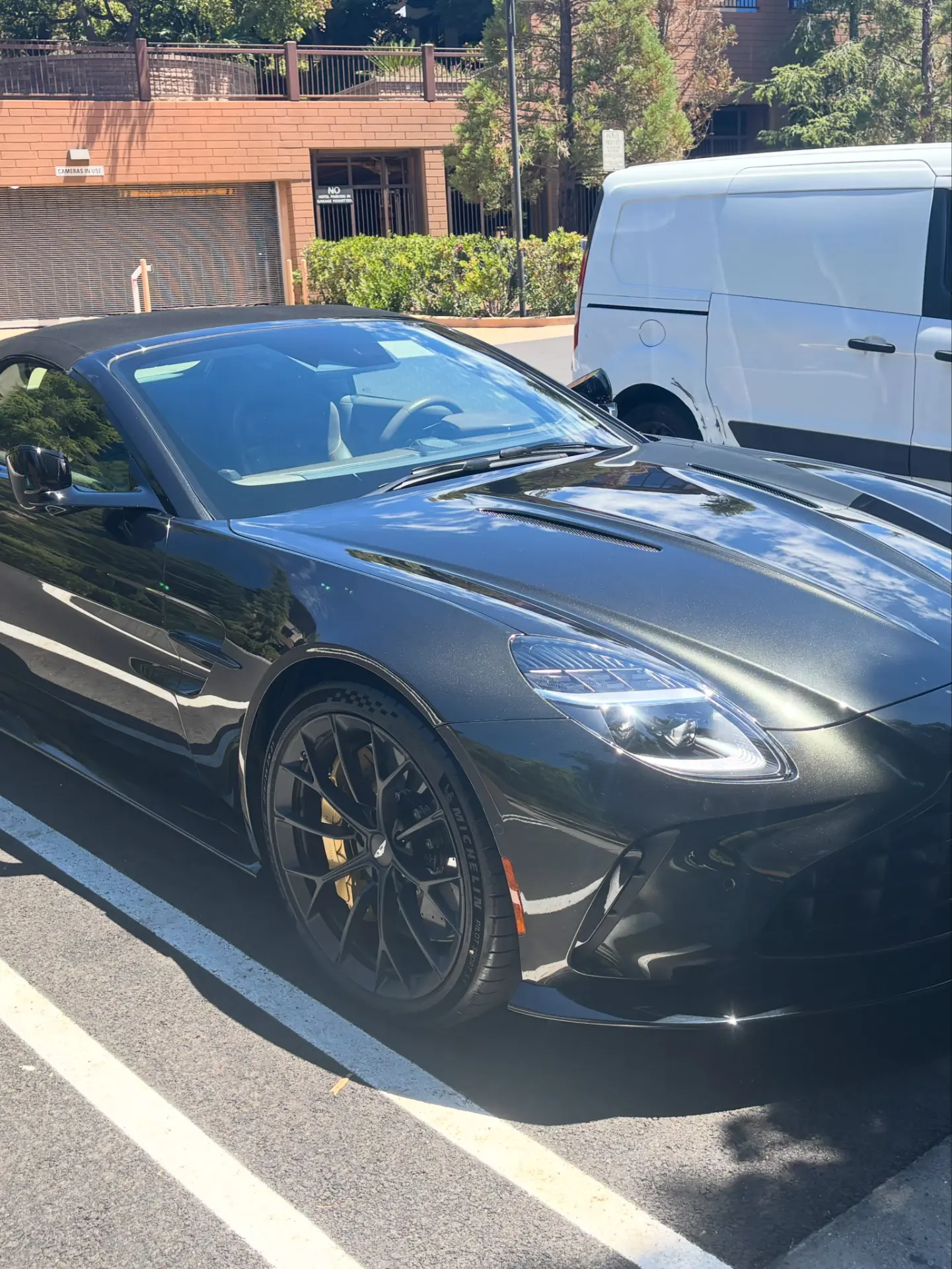 Black Aston Martin Vantage Roadster with a mirror-gloss finish after a WMD Detailing detail