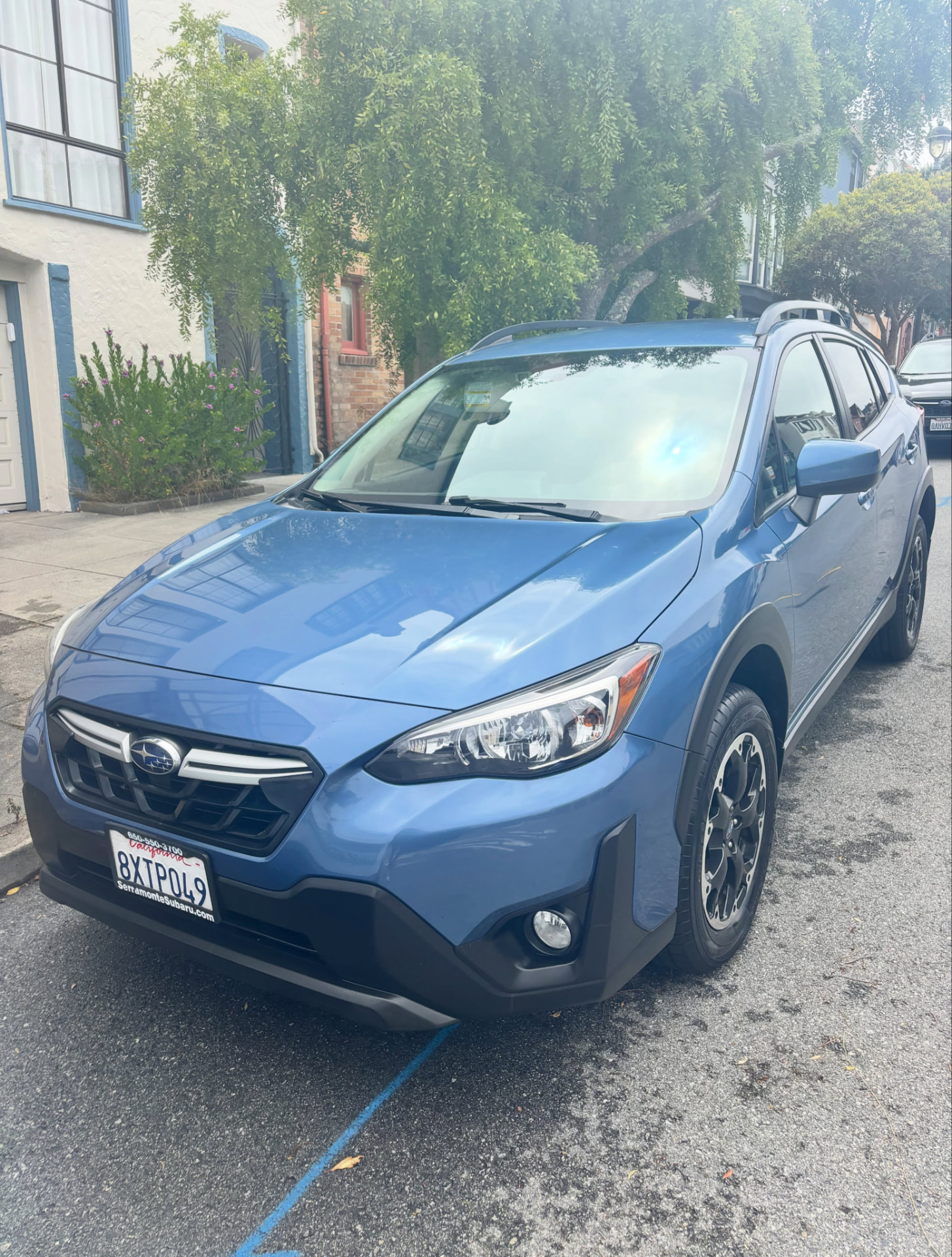 Green Subaru Crosstrek with a clean, glossy finish after detailing
